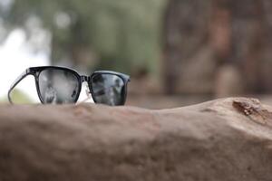Sunglasses on the beach in summer photo