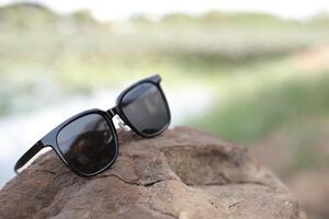 Sunglasses on the beach in summer photo