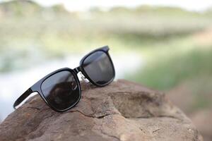 Sunglasses on the beach in summer photo