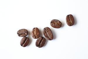Bean isolated on white, brown roasted coffee beans on white photo