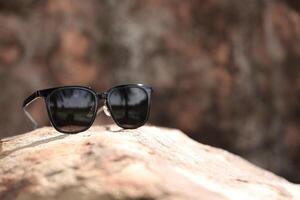 Sunglasses on the beach in summer photo
