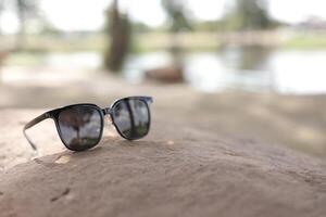 Sunglasses on the beach in summer photo