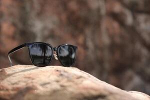 Sunglasses on the beach in summer photo