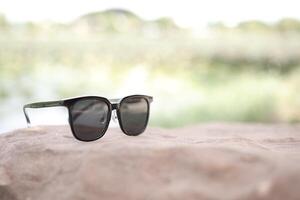 Sunglasses on the beach in summer photo