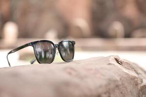 Sunglasses on the beach in summer photo