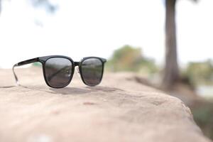 Sunglasses on the beach in summer photo