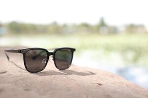 Sunglasses on the beach in summer photo