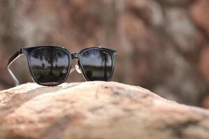 Sunglasses on the beach in summer photo