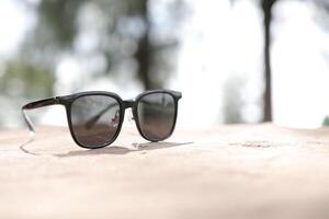 Sunglasses on the beach in summer photo