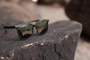 Sunglasses on the beach in summer photo