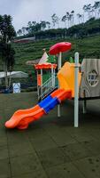 children's play area playground slide at lembah indah, Malang, Indonesia photo