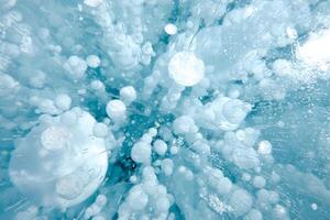 Cracks and bubbles in the ice of Lake Baikal photo