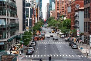 New York, US - May 7, 2023 - Busy street in New York downtown on a sunny day photo