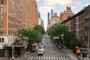New York, US - May 7, 2023 - Busy street in New York downtown on a sunny day photo