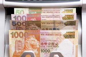 Hong Kong dollar in a counting machine photo