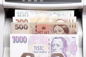 Czech koruna in the counting machine photo