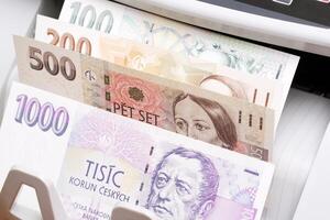 Czech koruna in the counting machine photo