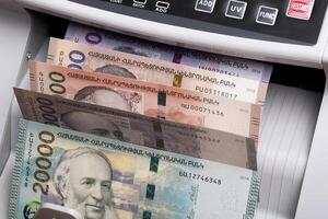 Armenian dram in a counting machine photo