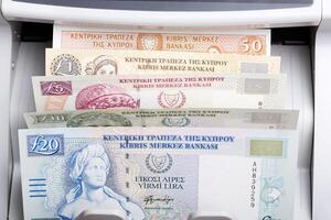Cypriot pound in a counting machine photo