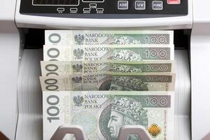 Polish money in a counting machine photo