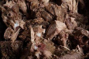 a close up of a pile of meat in a container photo