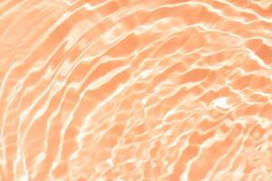 Bluewater waves on the surface ripples blurred. Defocus blurred transparent blue colored clear calm water surface texture with splash and bubbles. Water waves with shining pattern texture background. photo
