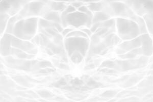Blue water with ripples on the surface. Defocus blurred transparent blue colored clear calm water surface texture with splashes and bubbles. Water waves with shining pattern texture background. photo