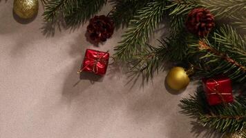 top view of spruce branches with Christmas ornaments and blinking bokeh lights, close-up video