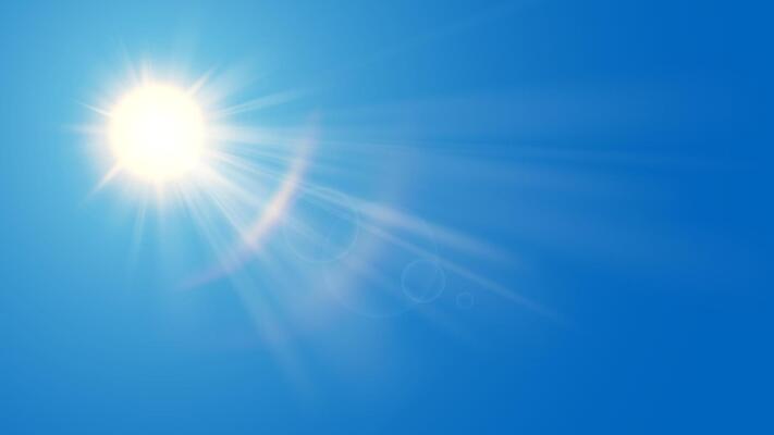Sun in blue sky. Bright warm sun and lens flare in clear summer sky, sunlight with sunshine glare rays. nature sunny spring landscape, bright sparkle burst.