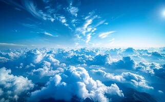 The sky is blue with a few clouds scattered throughout photo