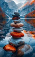 Zen stones stack in the lake. A stack of pebbles in front of a lake photo