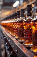 The row of the empty bottles on the conveyor belt in the factory photo