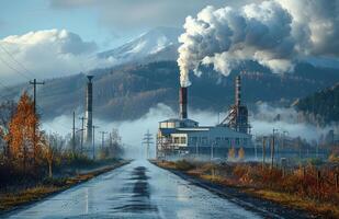 Factory and road with smoke coming out of the chimneys and mountain in the background photo