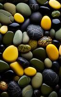 Variety of colorful pebbles. Pile of colorful patterned and textured pebbles photo