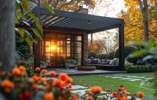 Modern pergola and comfortable garden furniture in the evening photo