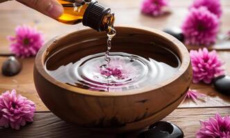 Aromatherapy and spa pouring water into bowl with flower petals photo
