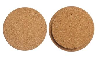 Brown bottle cap made from cork tree bark on isolated background, top view. photo