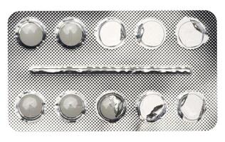 Empty blister pack of round pills on a white isolated background photo