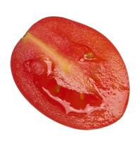 Half of a ripe cherry tomato on an isolated background, top view photo
