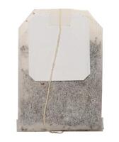 Disposable tea bag with paper label on a string photo