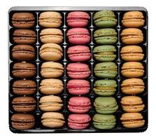 Multi-colored macarons in a plastic box, top view. Assortment photo