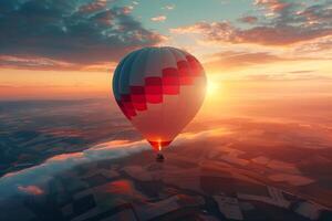 An enchanting hot air balloon ride at sunrise, with the golden glow over patchwork fields below photo
