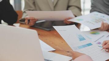 Financial analysts analyze business financial reports on a digital tablet planning investment project during a discussion at a meeting of corporate showing the results of their successful teamwork. video