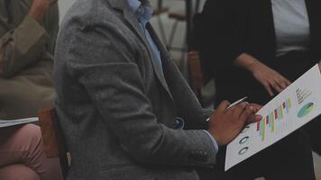 Financial analysts analyze business financial reports on a digital tablet planning investment project during a discussion at a meeting of corporate showing the results of their successful teamwork. video