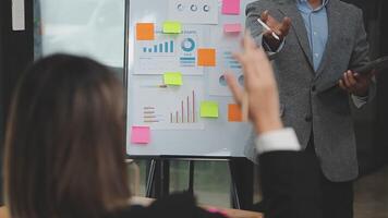 Financial analysts analyze business financial reports on a digital tablet planning investment project during a discussion at a meeting of corporate showing the results of their successful teamwork. video