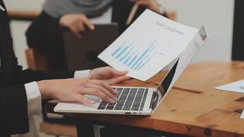 Financial analysts analyze business financial reports on a digital tablet planning investment project during a discussion at a meeting of corporate showing the results of their successful teamwork. video