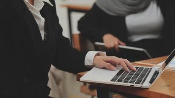 Financial analysts analyze business financial reports on a digital tablet planning investment project during a discussion at a meeting of corporate showing the results of their successful teamwork. video