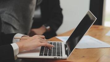 Financial analysts analyze business financial reports on a digital tablet planning investment project during a discussion at a meeting of corporate showing the results of their successful teamwork. video