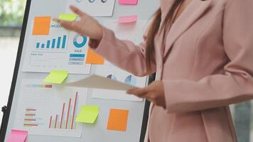 Financial analysts analyze business financial reports on a digital tablet planning investment project during a discussion at a meeting of corporate showing the results of their successful teamwork. video