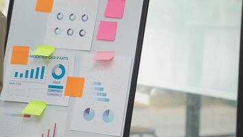 Financial analysts analyze business financial reports on a digital tablet planning investment project during a discussion at a meeting of corporate showing the results of their successful teamwork. video